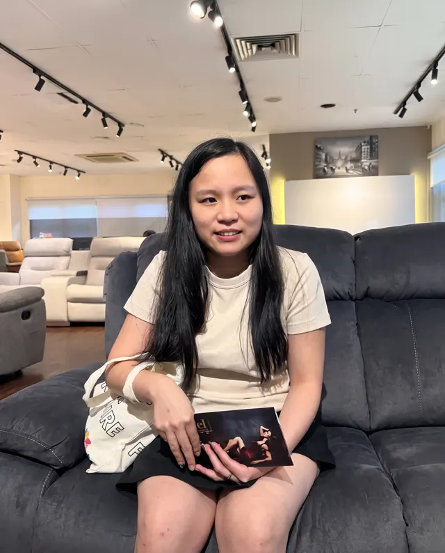 Alfedra seated on a recliner sofa at the Labrador showroom