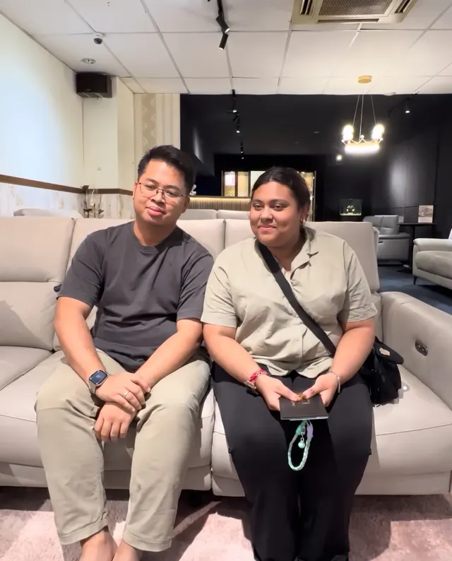 Has and her partner seated on a sofa at the Labrador showroom