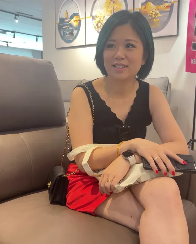 Lin seated on a leather sofa at the Labrador showroom